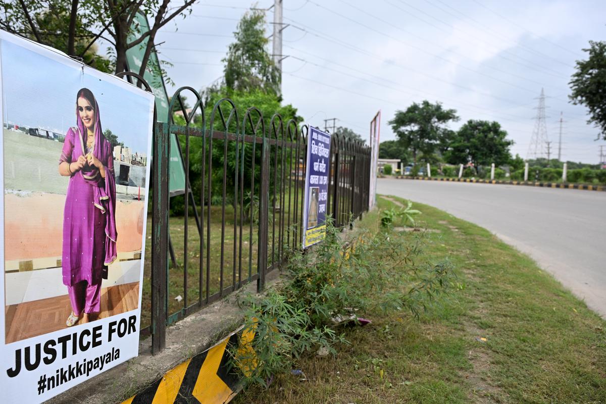 A poster demanding justice for Nikki Bhati in Greater Noida.